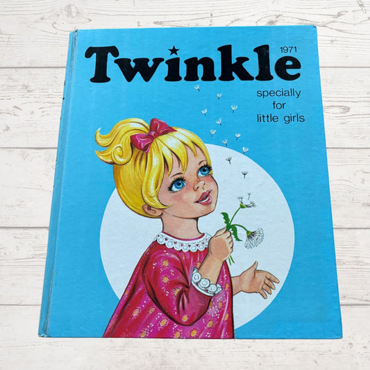 Vintage book titled 'Twinkle' from 1971 featuring a girl with blonde hair and a pink bow on a blue background.