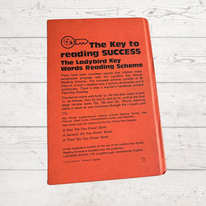Red book titled 'The Key to Reading Success' on a wooden surface