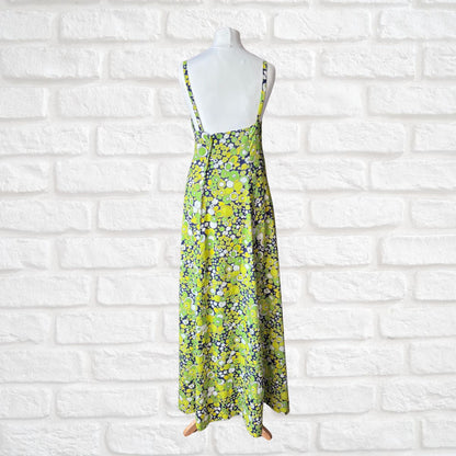 Floral dress on a mannequin against a white brick wall background