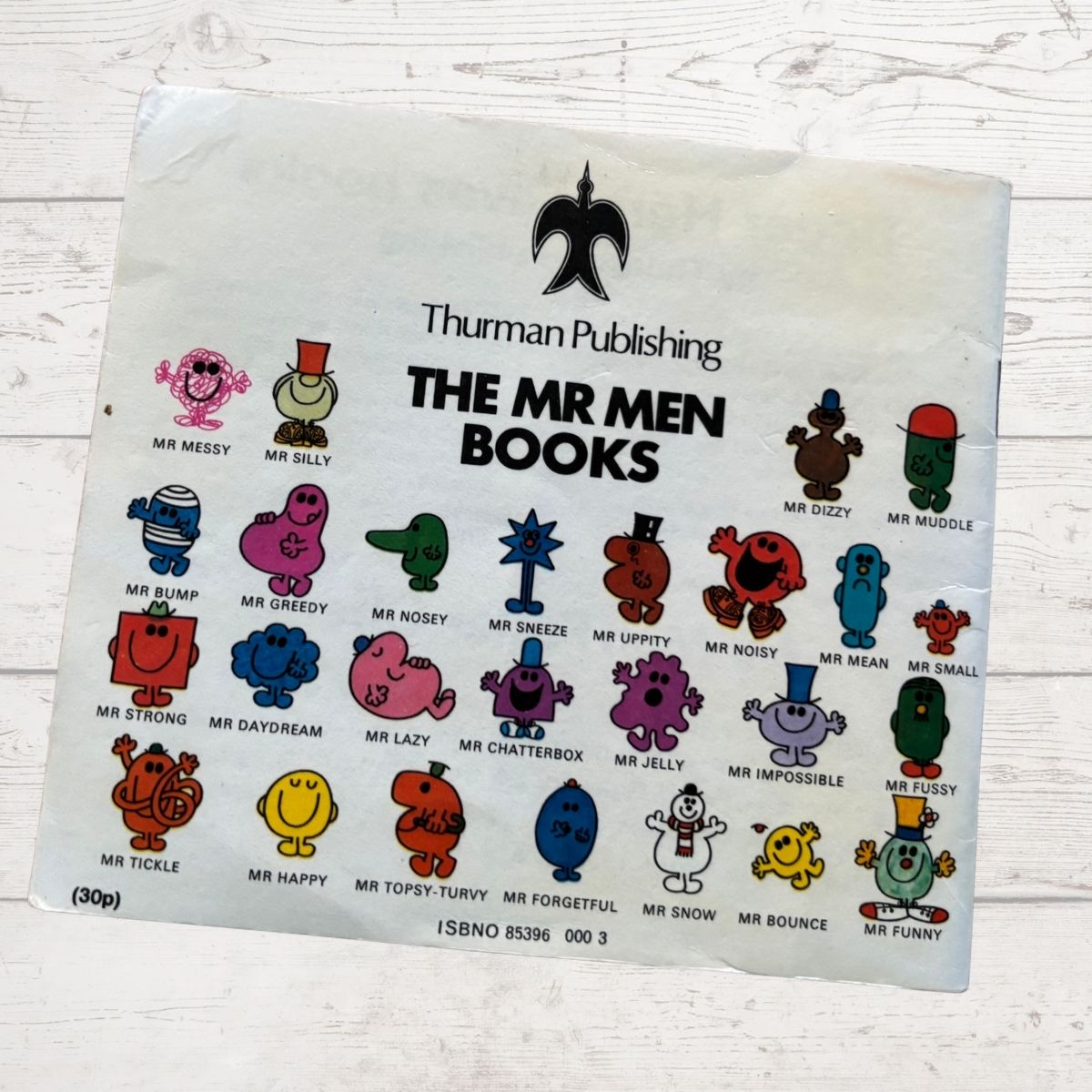 Back cover of mr  greedy featuring other mr men 