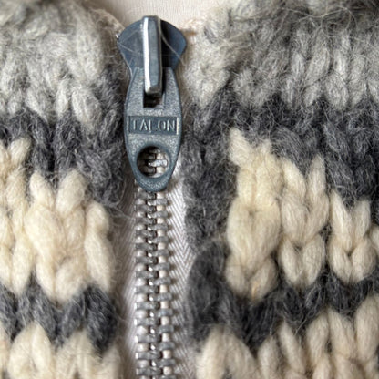 Close-up of a zipper on a textured fabric background