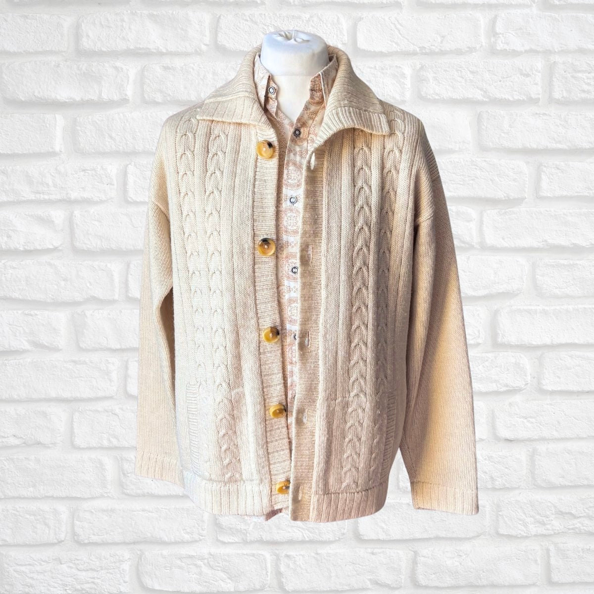 Wool vintage cream mens cardigan on a brick backdrop 
