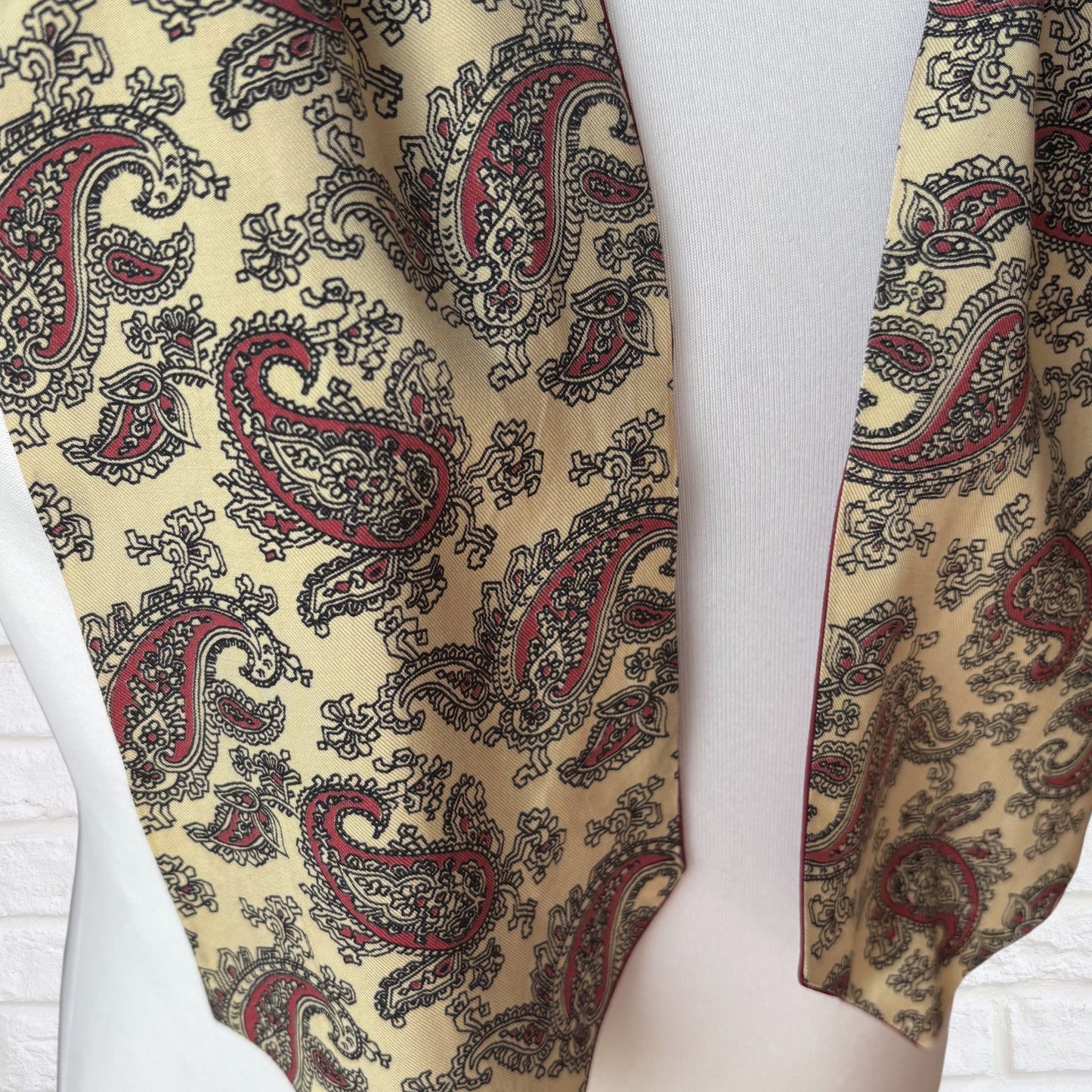 Paisley patterned tie on a white background
