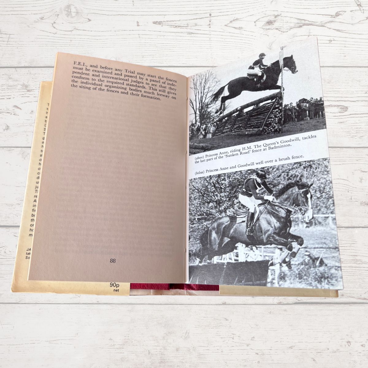 Open book with show jumping photos 