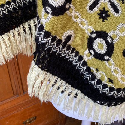 70s  green and black reversible fringed poncho/cape. Approx  U.K.  size 10 -16