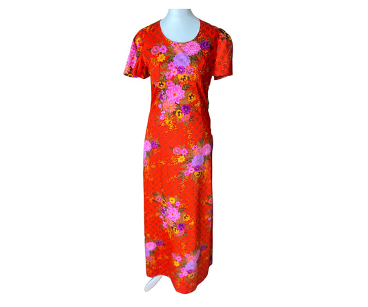 Bright orange floral vintage maxi dress with short sleeves and a scoop neckline 