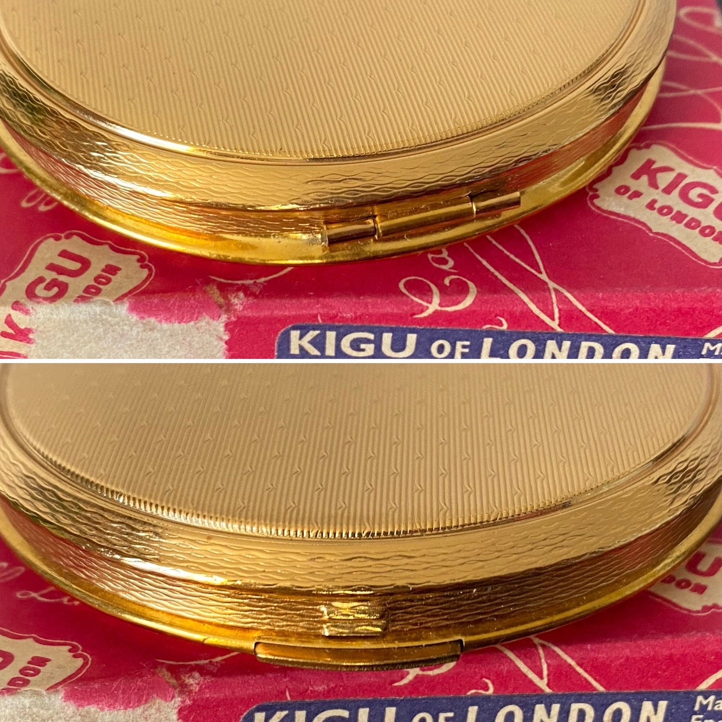 60s gold tone boxed and unused KIGU powder compact